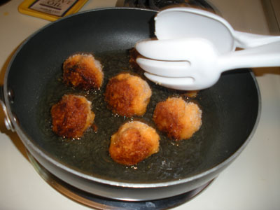 Turn the croquettes with tongs til golden brown all over